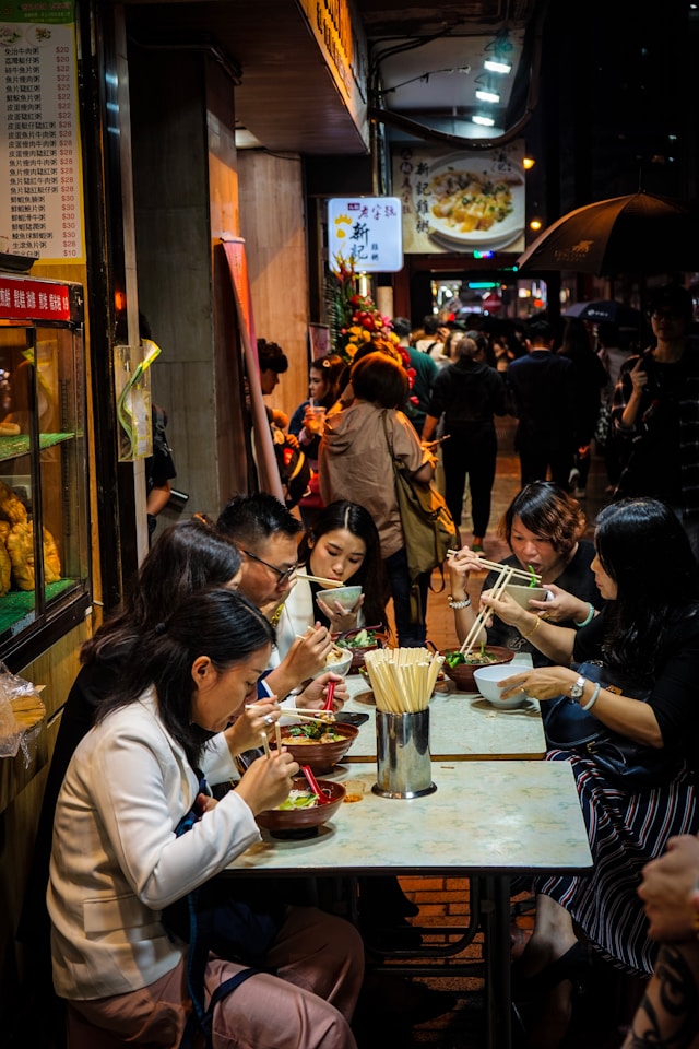 friends eating in a restaurant in hon g kong